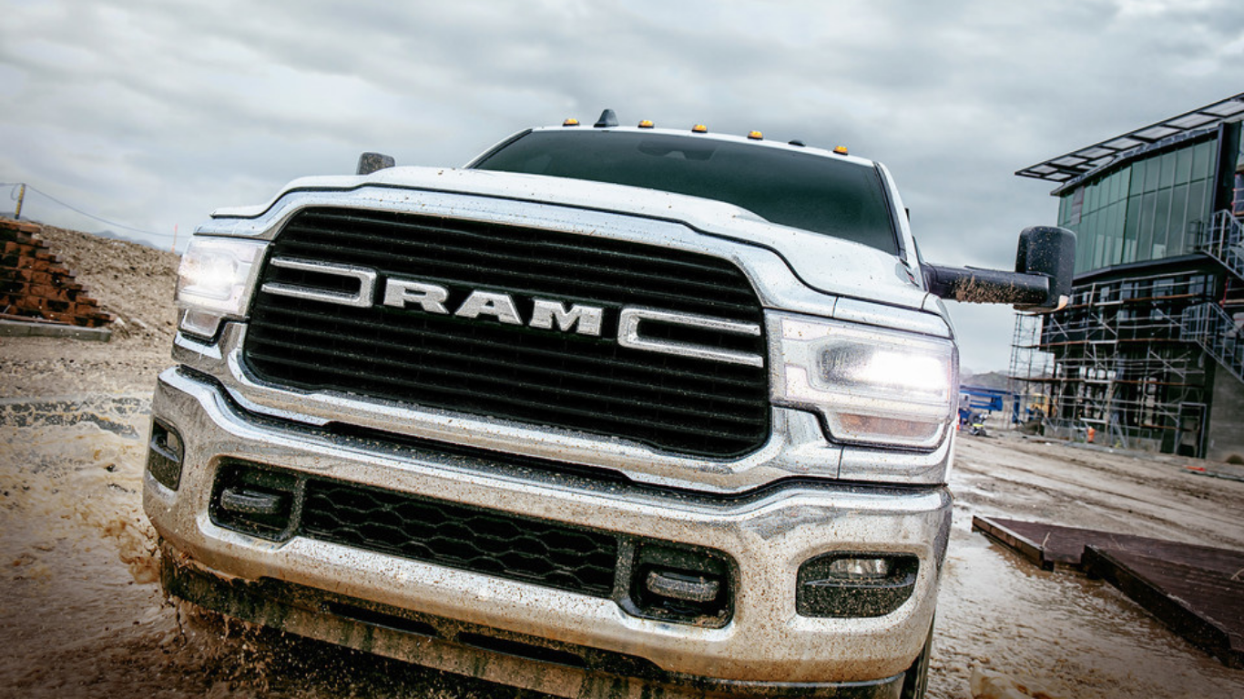  The powerful and impressive front grill of a Ram 3500 standing ready on the job site.